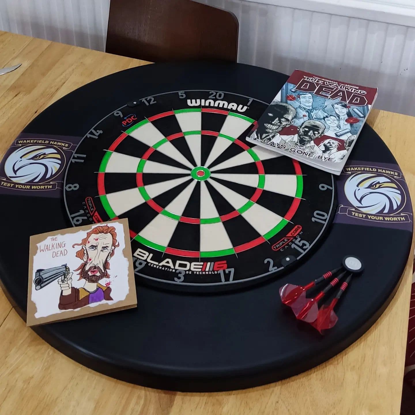 Ah the dizzy heights of 15
Nothing says northern teen more than this table of delights.
#birthday
#darts
#thewalkingdead 
#rugby
